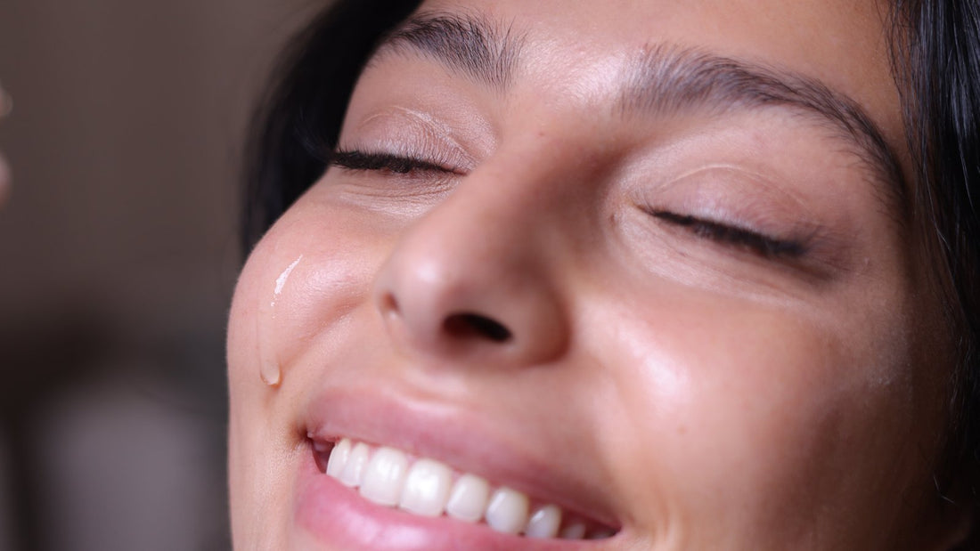 Smiling woman with clear, glowing skin